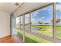 A tranquil water view framed by a large window showcases the outdoor scenery and natural light at 4736 Independence Dr # 4736, Bradenton, FL 34210