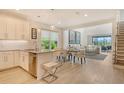 Open-concept kitchen with modern appliances, stylish countertops, and an adjacent dining area at 5475 Summit Gln, Bradenton, FL 34203