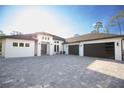 Stunning modern home with a spacious driveway and two-car garage, offering curb appeal and convenience at 6713 Taneytown St, North Port, FL 34291