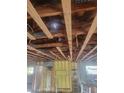 Interior view of a home under construction, showing ceiling rafters and framing at 754 Gran Kaymen Way, Apollo Beach, FL 33572