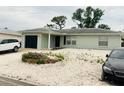 Neat single-story home with a rock garden, complemented by tasteful landscaping and attached garage at 8409 43Rd W Ave, Bradenton, FL 34209