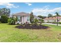 Well-manicured lawn with tasteful landscaping frames this delightful single-story home at 1015 143Rd Ne St, Bradenton, FL 34212