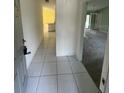 Tiled entryway leading to the kitchen and living room at 1036 Arden Nw Ter, Port Charlotte, FL 33948