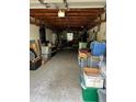 Spacious garage filled with storage containers and household items at 14396 Pambar Ave, Port Charlotte, FL 33953