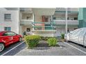 Charming building exterior with well-maintained landscaping and dedicated parking spaces at 1838 Restful Dr # K-1, Bradenton, FL 34207