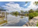 Scenic waterfront view showcases a tranquil canal and lush greenery, perfect for boating at 2002 8Th W St, Palmetto, FL 34221
