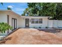 Lovely home featuring well-maintained landscaping, a cozy front entry, and a spacious driveway at 2363 Milford Cir, Sarasota, FL 34239