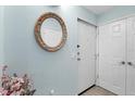 Welcoming entryway with stylish mirror and neutral walls, creating a bright and inviting space at 2740 Orchid Oaks Dr # 304, Sarasota, FL 34239