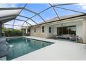 Stunning screened-in pool and patio area with serene views of the surrounding greenery at 5240 Bentgrass Way, Bradenton, FL 34211