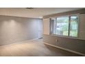 Bright living room with hardwood floors, recessed lighting, and large windows at 5325 Murdock Ave, Sarasota, FL 34231