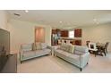 Open-concept living area featuring tile flooring, neutral walls, and comfortable seating at 6204 Horse Mill Pl, Palmetto, FL 34221