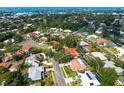 Aerial view showcases the property's pool, tile roof and proximity to the bay at 7460 Dickens Dr, Sarasota, FL 34231