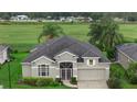 Expansive aerial view of home featuring manicured lawn and landscaping at 7744 Castleisland Dr, Sarasota, FL 34240