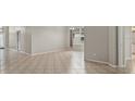 View of bright, neutral living room with tile flooring and recessed lighting at 7744 Castleisland Dr, Sarasota, FL 34240