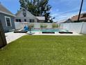 Backyard pool with lush lawn and stylish landscaping at 783 30Th N Ave, St Petersburg, FL 33704