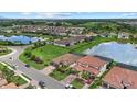 Beautiful community featuring waterfront properties, lush green landscaping, and serene views of the surrounding area at 14216 Florida Rosemary Dr, Bradenton, FL 34211