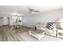 Open-concept living room flows into the kitchen, with hardwood floors and abundant natural light at 150 Harborside Ave # 307, Punta Gorda, FL 33950