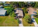 Aerial view of the home's layout among neighborhood, highlighting roof and lot size at 1862 Rita St, Sarasota, FL 34231