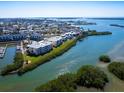 Stunning aerial view of waterfront condos surrounded by lush greenery and shimmering waterways at 2424 Placida Rd # D102, Englewood, FL 34224