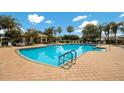 Community pool with ample seating and a clubhouse at 3402 Parkridge Cir, Sarasota, FL 34243