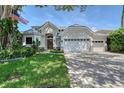 Stunning home featuring manicured front yard, two-car garage, and an eye-catching architectural design at 3921 Maravic Pl, Sarasota, FL 34231