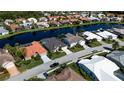 Community aerial view of homes along a serene lake, providing a tranquil setting at 4257 Hearthstone Dr, Sarasota, FL 34238