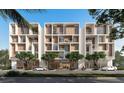 Modern condo building exterior with balconies, wood accents, street view, and tropical landscaping at 430 Kumquat Ct # 410, Sarasota, FL 34236