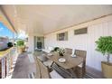 Inviting covered patio with stylish outdoor furniture, perfect for dining and relaxing at 5213 Bel Air Ave, Sarasota, FL 34234