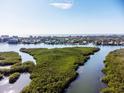 Picturesque aerial view of the coastal waterway and lush mangrove islands at 5450 Eagles Point Cir # 404, Sarasota, FL 34231