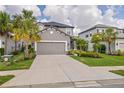Charming two-story home featuring a two car garage, landscaped yard, and covered porch at 5532 Summit Gln, Bradenton, FL 34203