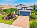 Aerial view showcasing the home's architectural style, landscaping, and proximity to neighboring properties at 5740 Eagle Creek Rd, Sarasota, FL 34238