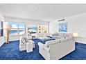 Bright living room featuring expansive ocean views and stylish, comfortable seating at 601 Longboat Club Rd # 504S, Longboat Key, FL 34228
