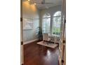 Bright office featuring hardwood floors, a ceiling fan, and French doors at 6839 Turnberry Isle Ct, Lakewood Ranch, FL 34202
