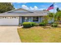 Charming single-story home featuring a well-maintained front yard, driveway, and attached garage at 7615 17Th W Ave, Bradenton, FL 34209