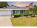 Charming single-story home featuring a well-maintained front yard, driveway, and attached garage at 7615 17Th W Ave, Bradenton, FL 34209