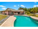 Inviting backyard pool with ample deck space for relaxing and entertaining at 7615 17Th W Ave, Bradenton, FL 34209