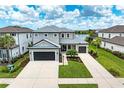Elegant two-story home featuring a spacious driveway and beautiful landscaping at 8264 Summer Night Rd, Sarasota, FL 34241
