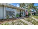 Well-maintained home with a welcoming porch and beautifully landscaped surroundings at 946 N Beneva Rd # V26, Sarasota, FL 34232