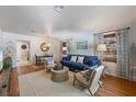 Comfortable living room with stylish decor, hardwood floors, and an inviting open floor plan at 109 Maple Ave, Anna Maria, FL 34216
