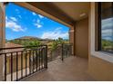 Inviting balcony view overlooking lush treetops and terracotta rooftops under a bright, sunny sky at 13810 Messina Loop # 202, Bradenton, FL 34211