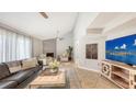 Comfortable living room with fireplace, decor and entertainment center at 2420 Webber St, Sarasota, FL 34239
