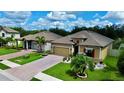 Beautiful single-story home with a well-kept lawn and brick paver driveway at 3712 76Th E St, Palmetto, FL 34221