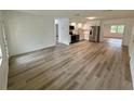 Open-concept living area featuring new floors, fresh paint, and plenty of natural light at 4110 Longhorn Dr, Sarasota, FL 34233