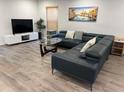 Cozy living room featuring stylish furnishings and ample natural light at 4441 Groveland Ave, Sarasota, FL 34231