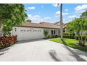 Charming single-story home with a well-maintained lawn, beautiful landscaping, and a two-car garage at 4472 Calle Serena, Sarasota, FL 34238