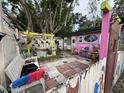Charming backyard retreat with unique decorations, stone pavers, and a tranquil fountain at 5011 Elfrida Ave, Sarasota, FL 34235