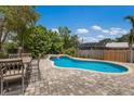 Inviting pool and spa with brick paver patio, perfect for outdoor entertaining and relaxation at 715 Fontana Ln, Bradenton, FL 34209