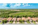 Aerial shot of home showcasing location, landscaping, and proximity to natural area at 11625 Parrotfish St, Venice, FL 34292