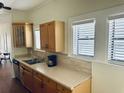 Well-lit kitchen featuring wooden cabinets, modern appliances, and neutral countertops at 1412 12Th W Ave, Bradenton, FL 34205