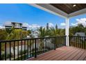 Spacious balcony offering neighborhood views, perfect for outdoor relaxation and entertainment at 2213 Avenue C, Bradenton Beach, FL 34217